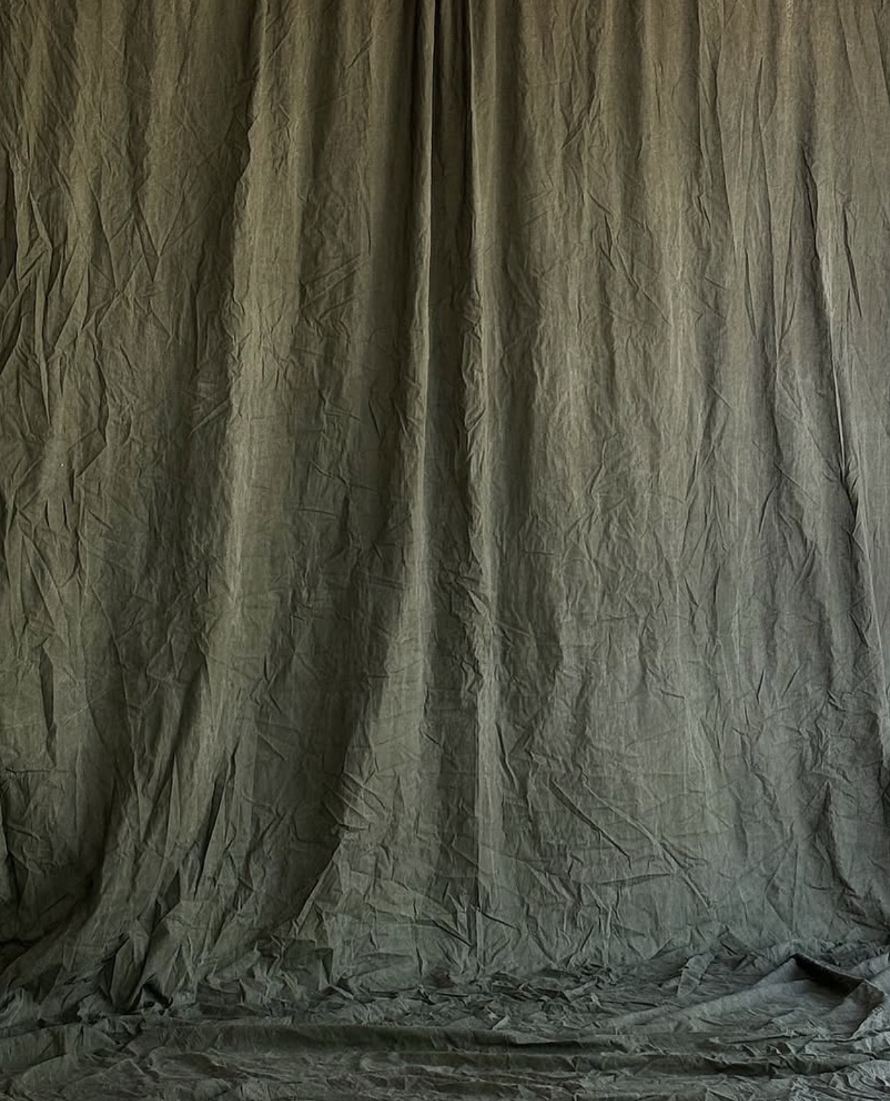 Green drapery backdrop